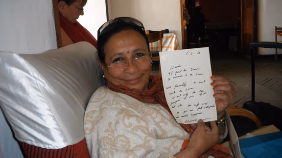 Hashi holding a letter from The Mother