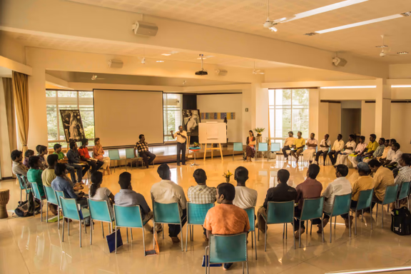 Youth from the neighbourhood attending a presentation in the Unity Pavilion