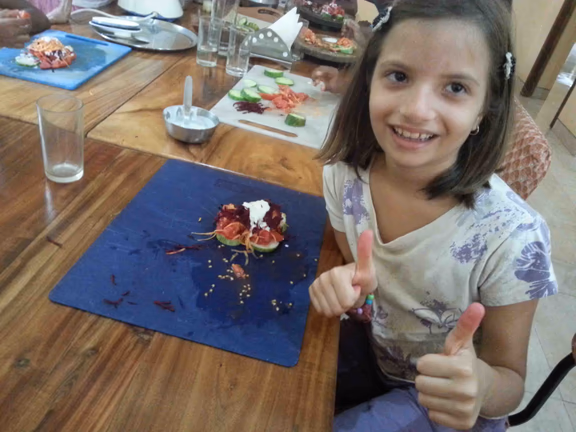 Food preparation in Anandi’s raw food restaurant - it tastes good!