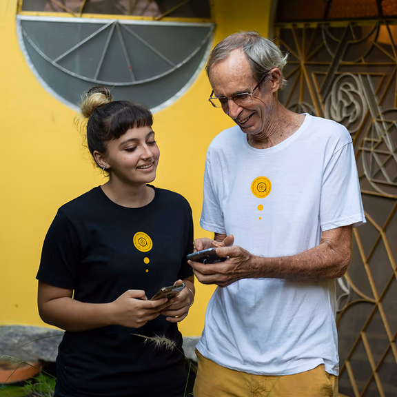 Jasmine and B looking at the Aura app