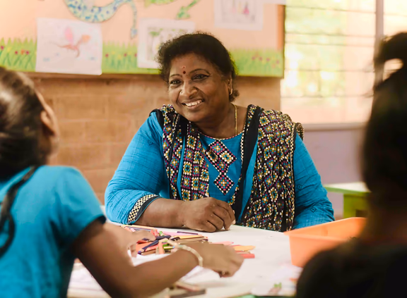 Amudha taking a class