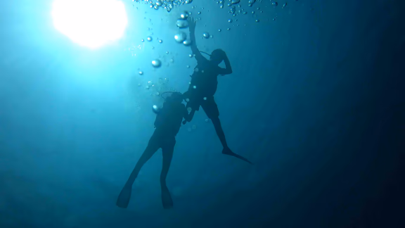 Freedom: assisting someone with disability to scuba dive