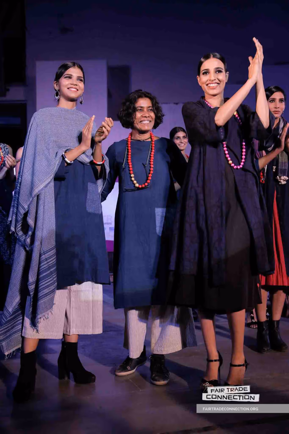Uma (middle) with models at the Fair Trade Forum India fashion show in New Delhi