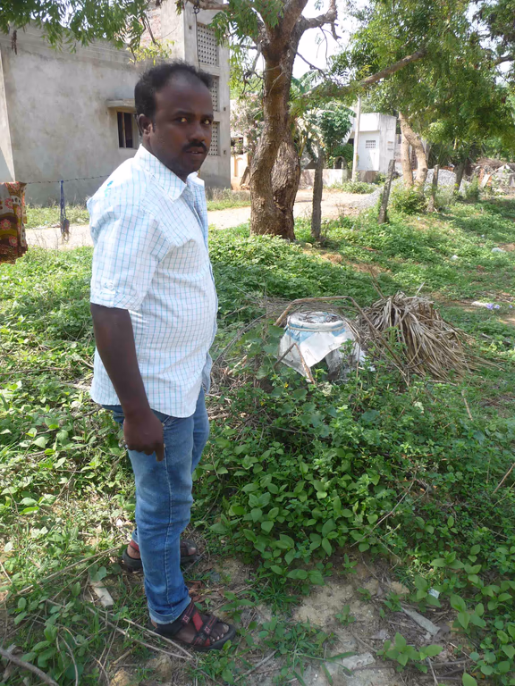 A villager from Annai Nagar shows the illegally-dug bore well
