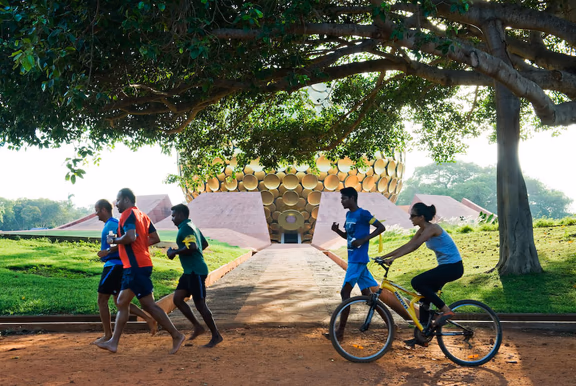 Barefoot running in front of Matrimandir
