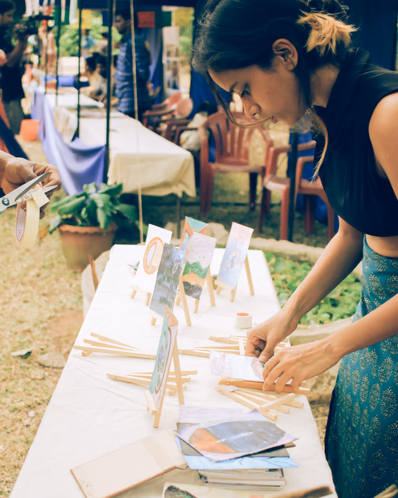 1 A member of YouthLink displays artwork